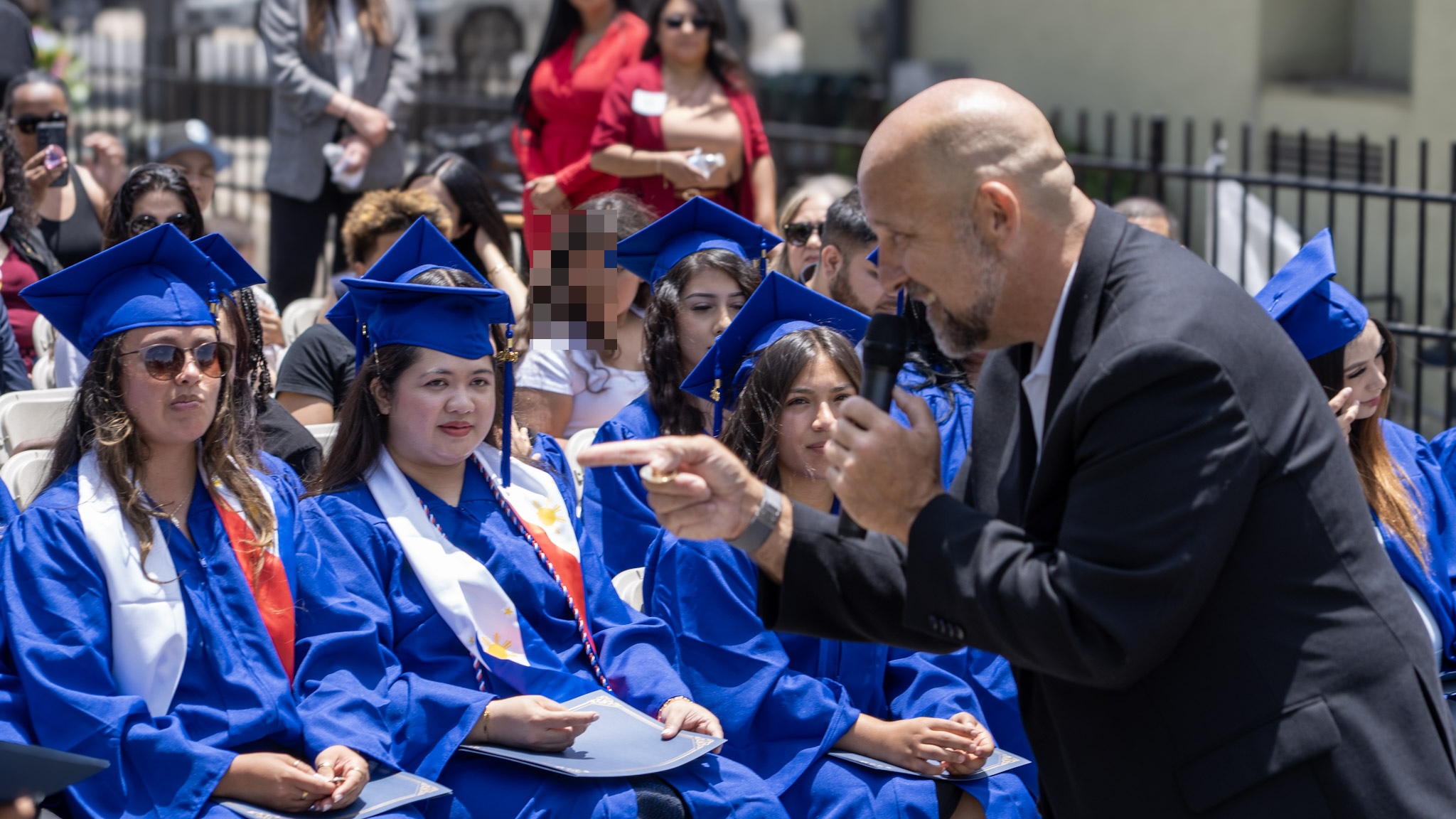 Damien Weston speaking directly to graduates at the ceremony
