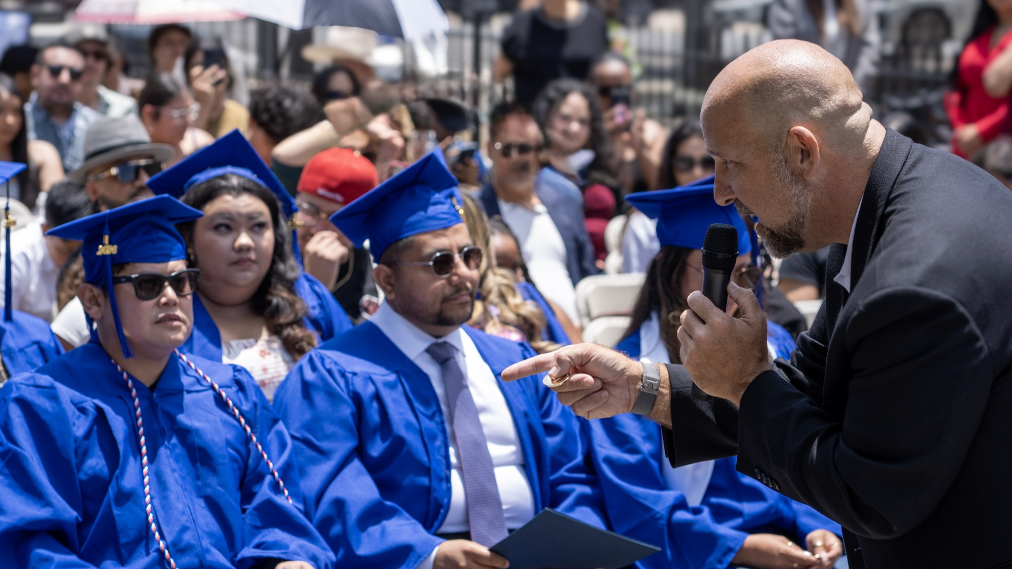 Damien Weston engaging with graduates during the commencement speech